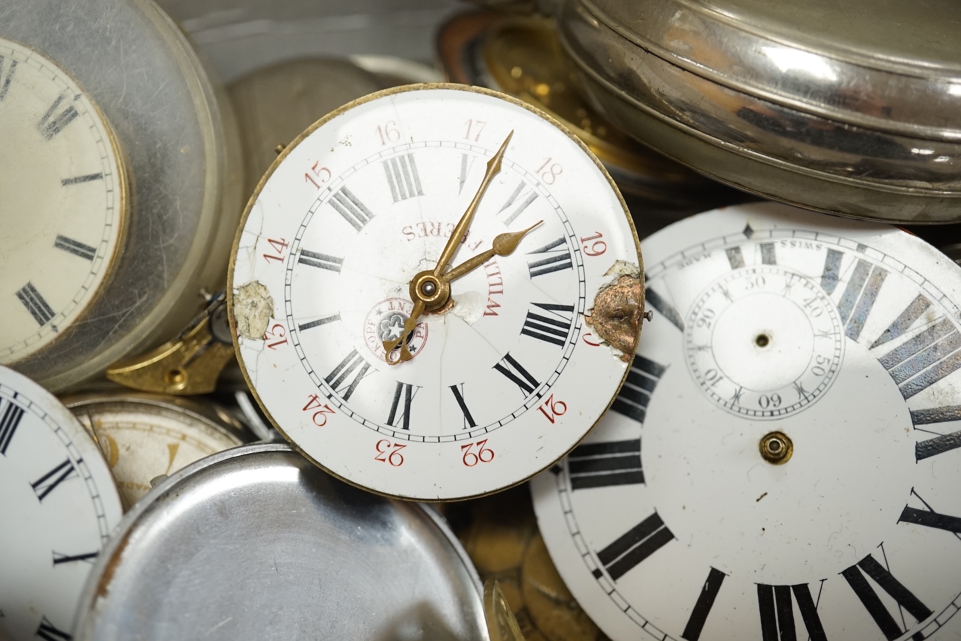 A collection of pocket watch cases (some silver), movements, dials and parts. Condition - poor